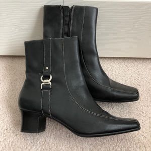 Covington black leather booties with buckle detail